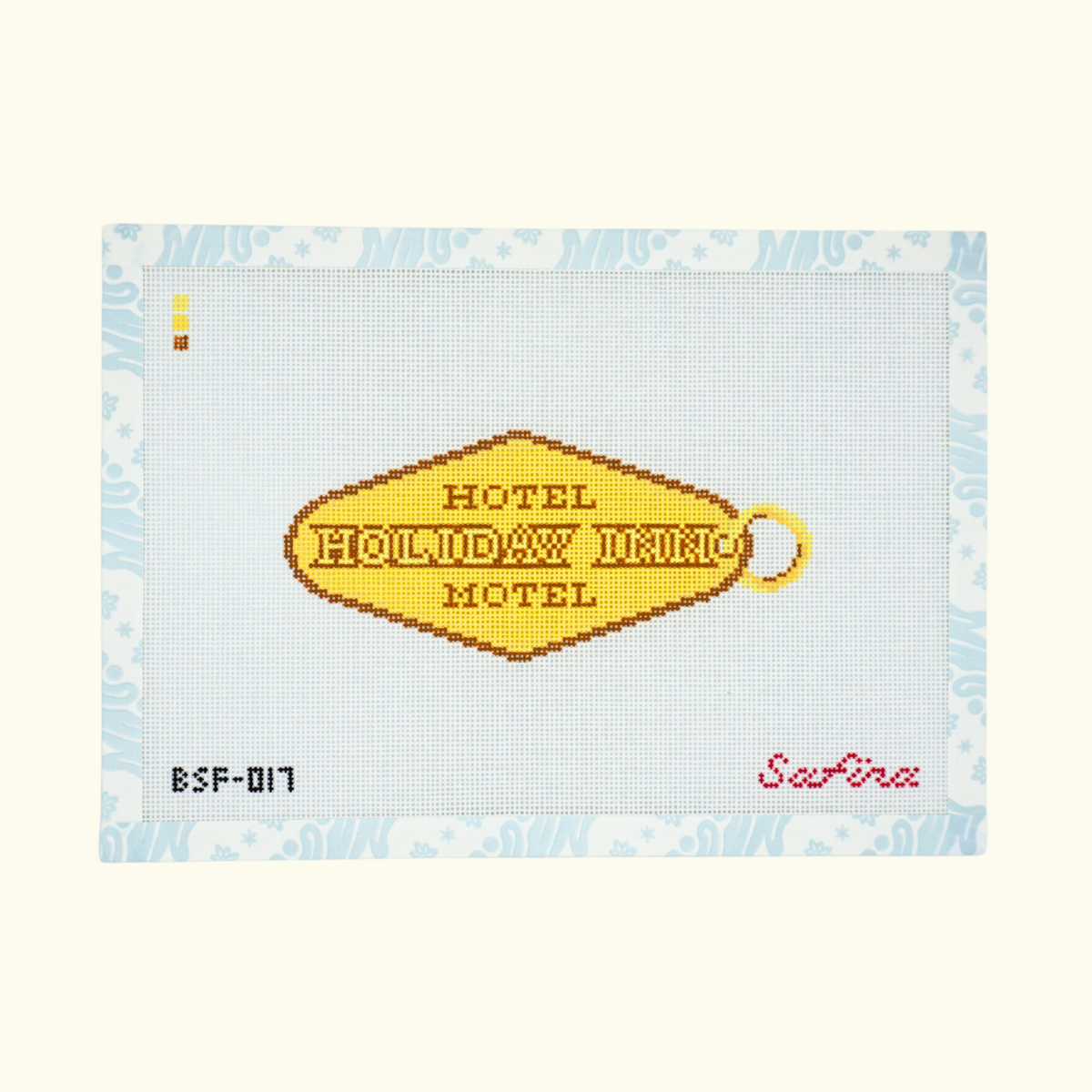 Gold hotel key tag with The Hotel Motel Holiday Inn text needlepoint canvas