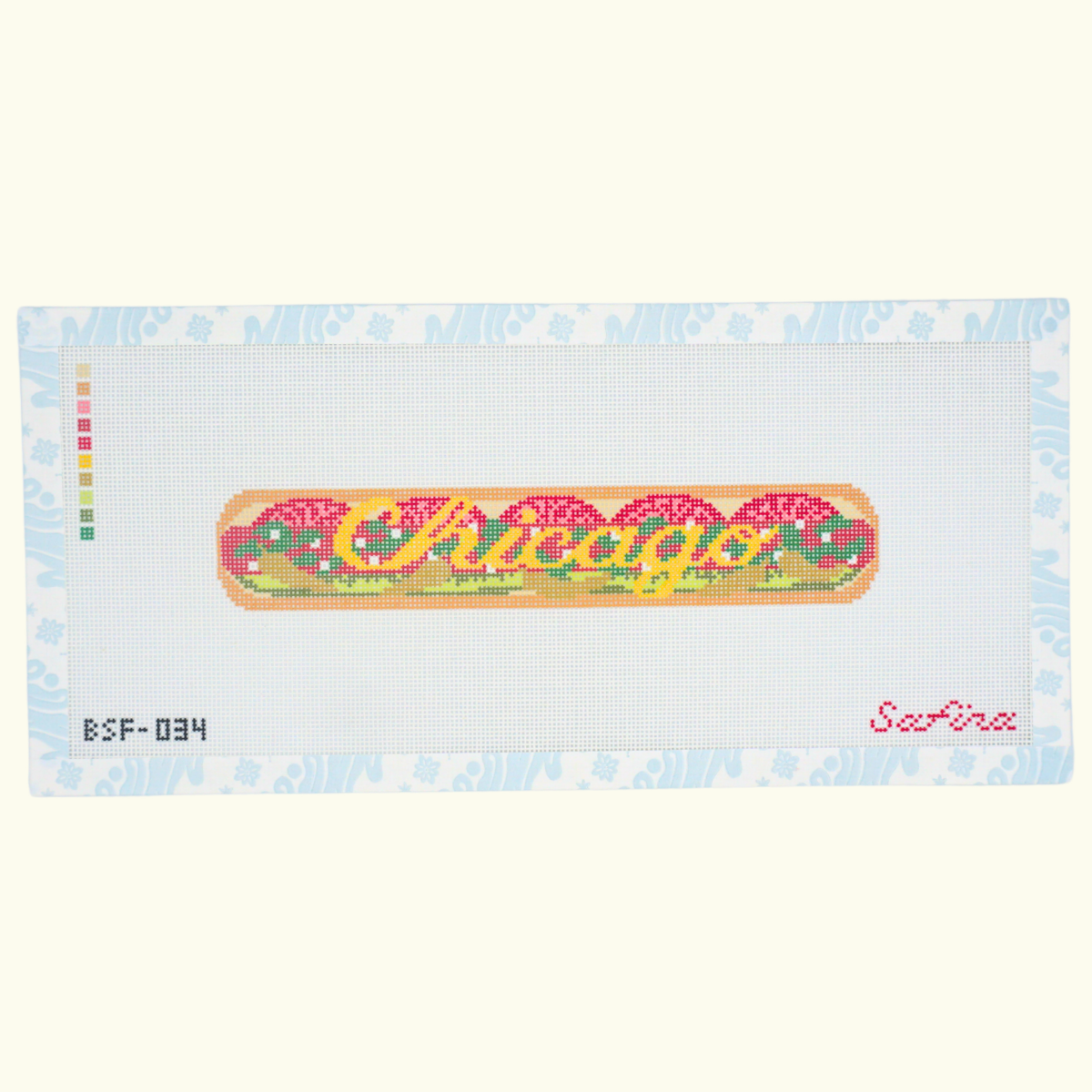 Needlepoint canvas and key fob of a colorful Chicago hot dog design including toppings and Chicago text