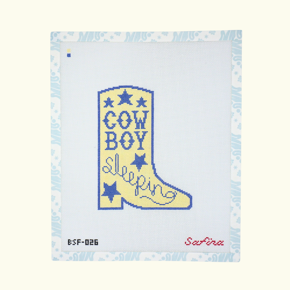 Blue and yellow cowboy boot needlepoint canvas with stars and cowboy sleeping text