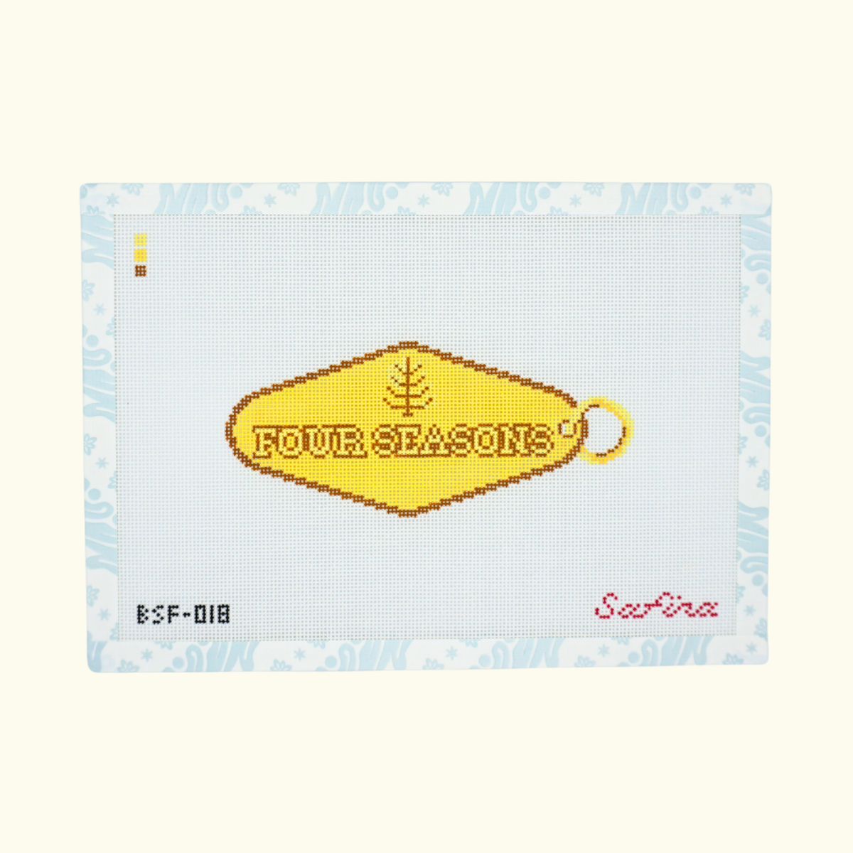 Gold hotel key tag with Four Seasons text needlepoint canvas 