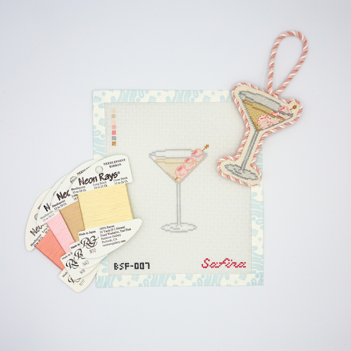 Lychee martini needlepoint canvas with fibers threads and finished lychee martini needlepoint ornament