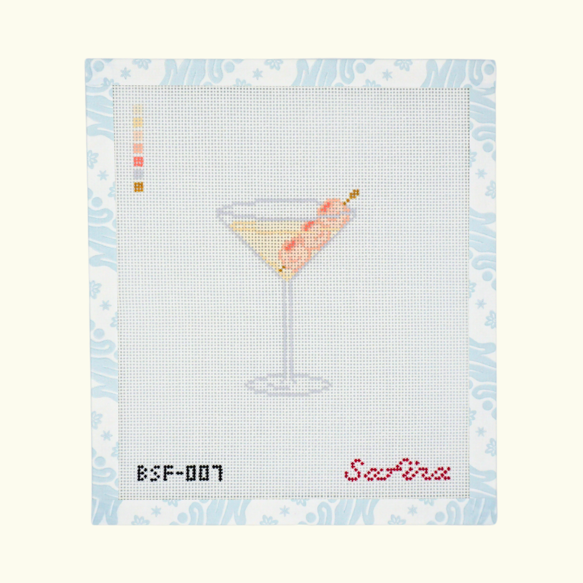 Lychee martini garnished with lychees in a martini glass needlepoint canvas